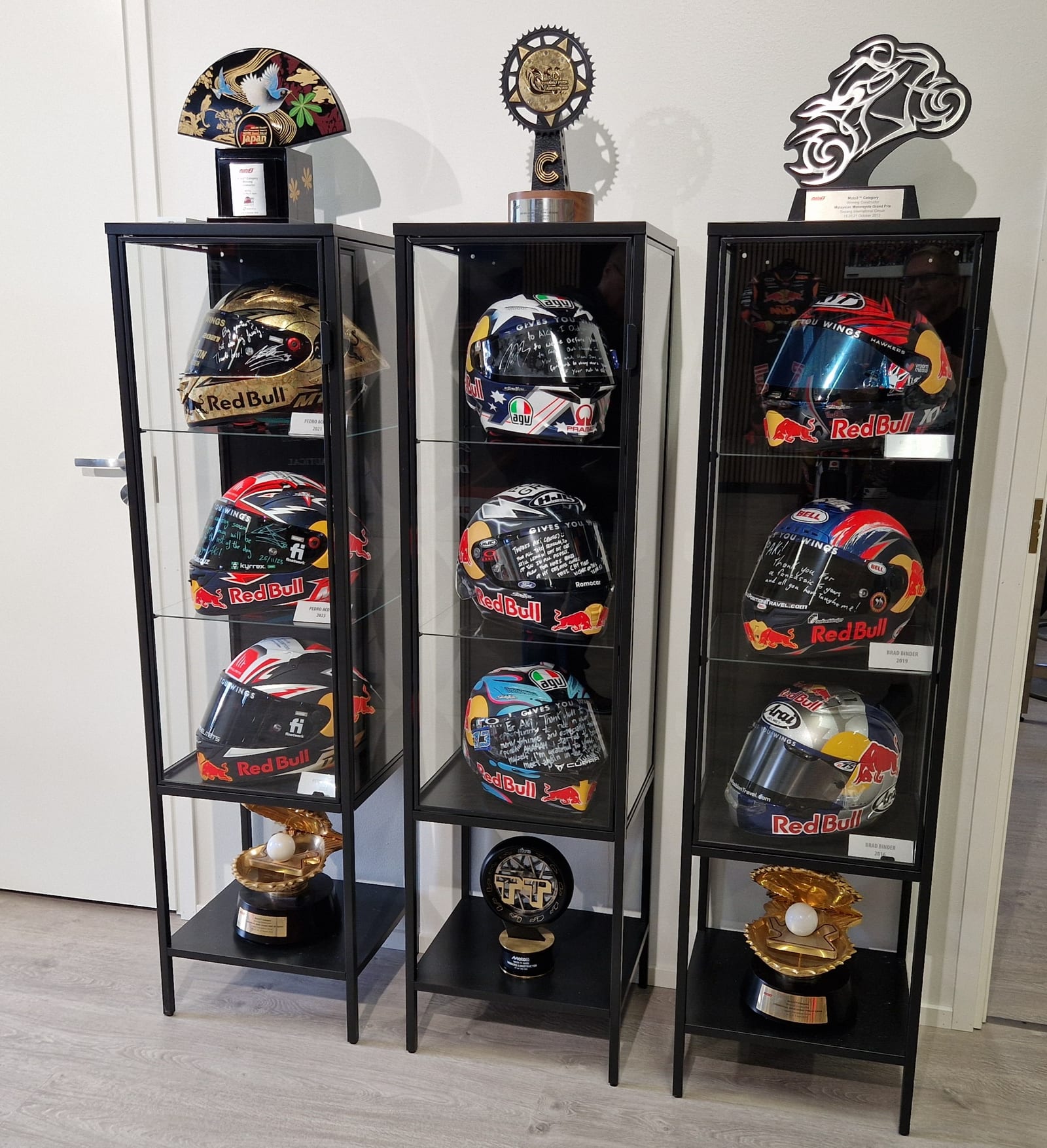 Helmets of riders who won championships for Ajo Motorsport, with thank-you messages at Aki Ajo's
